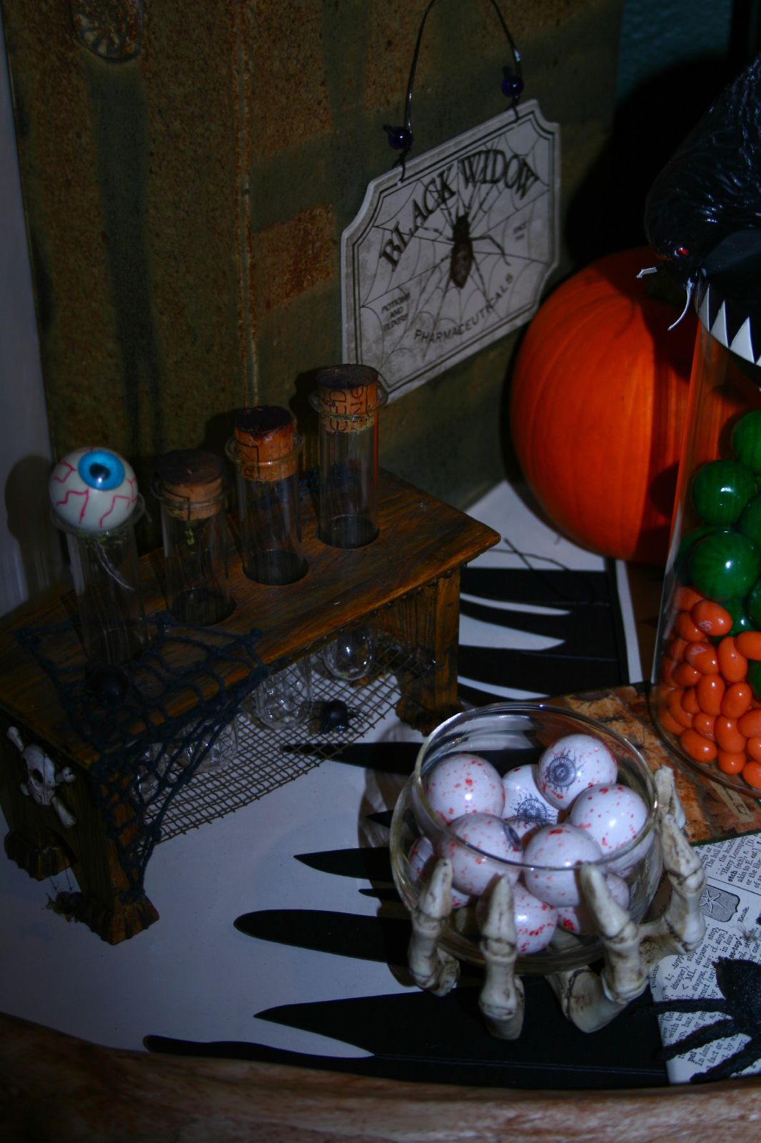 halloween decoration on a table with candy and decor