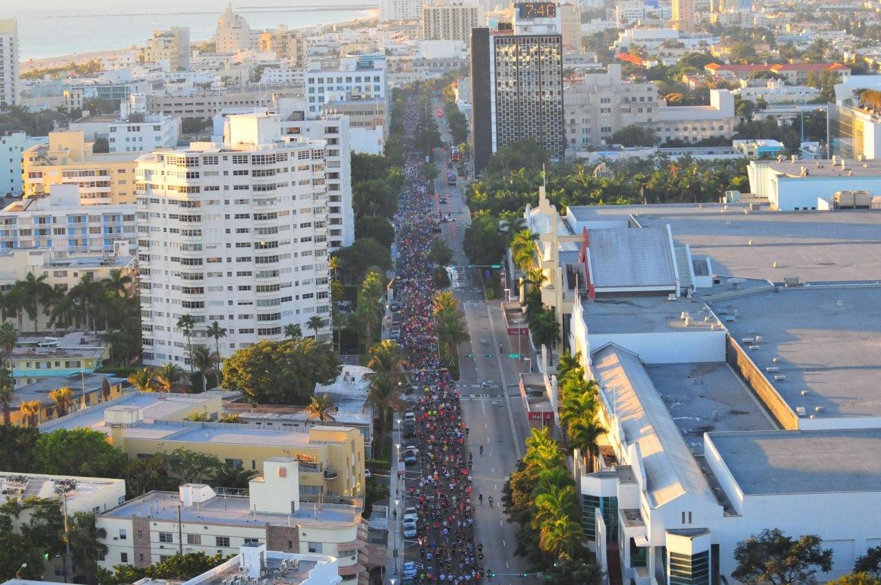 many people are in the road and some buildings