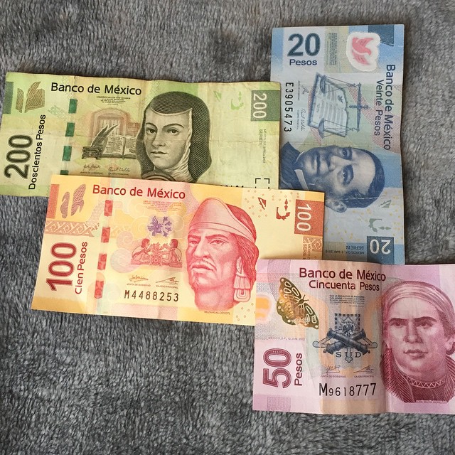 mexican currency that are not authentic on a table