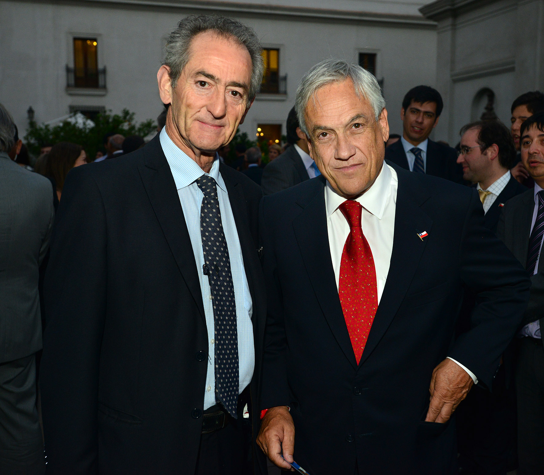 two men standing together at an event
