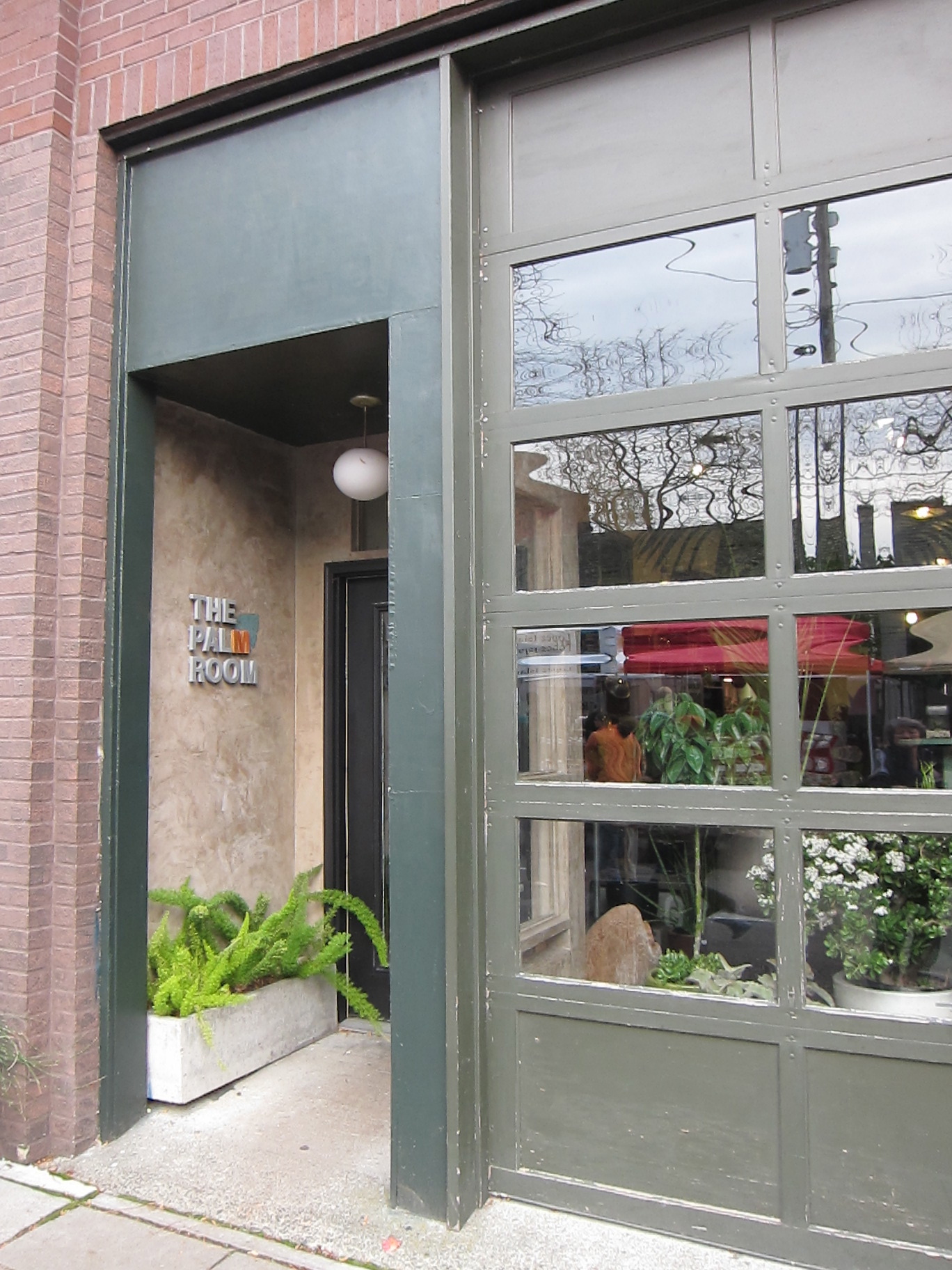 a large entrance to a restaurant with an open door