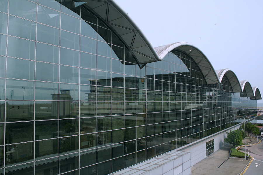 an airplane hangar next to a tall building