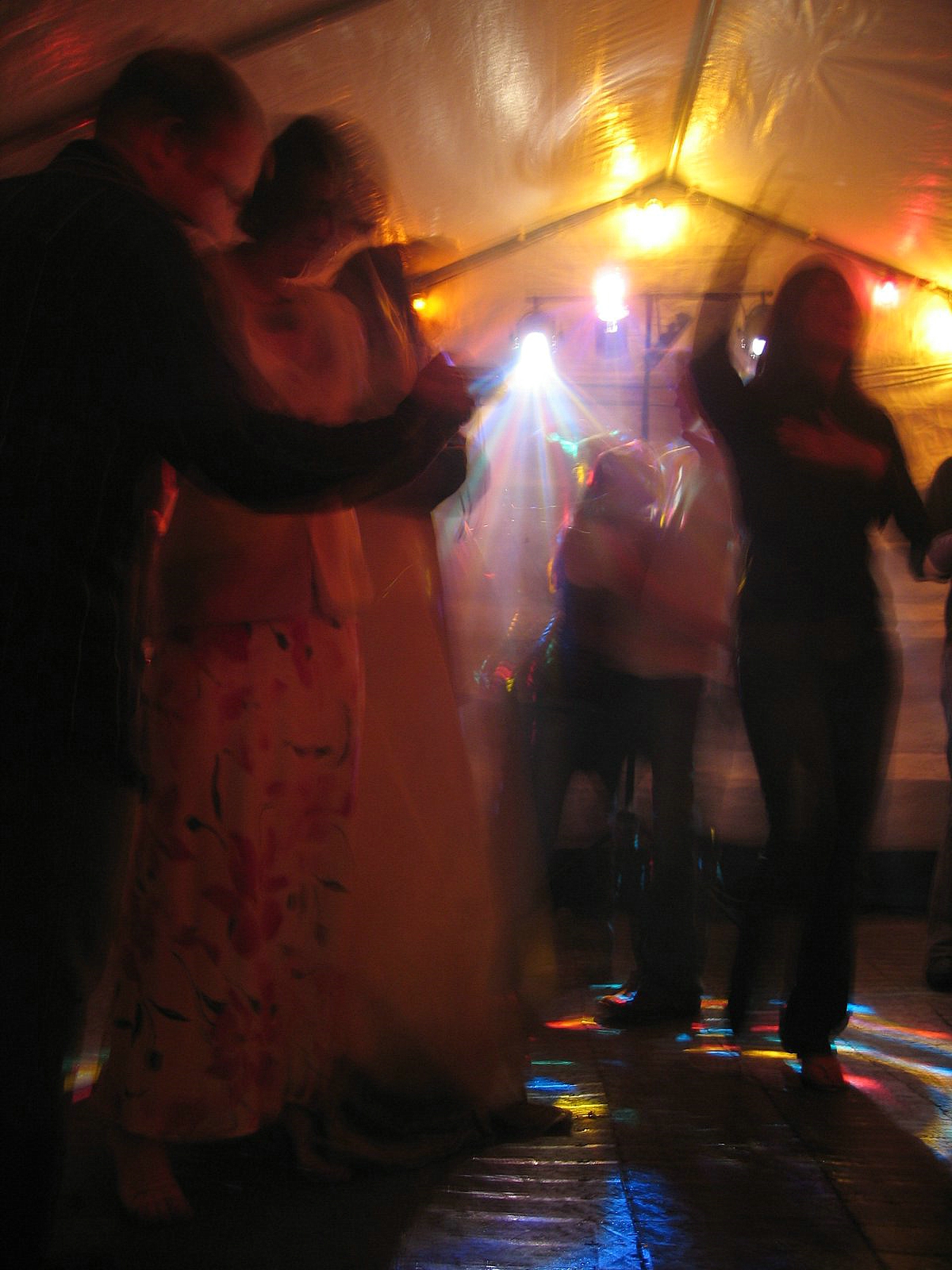 a dance party has people in dress and dark attire