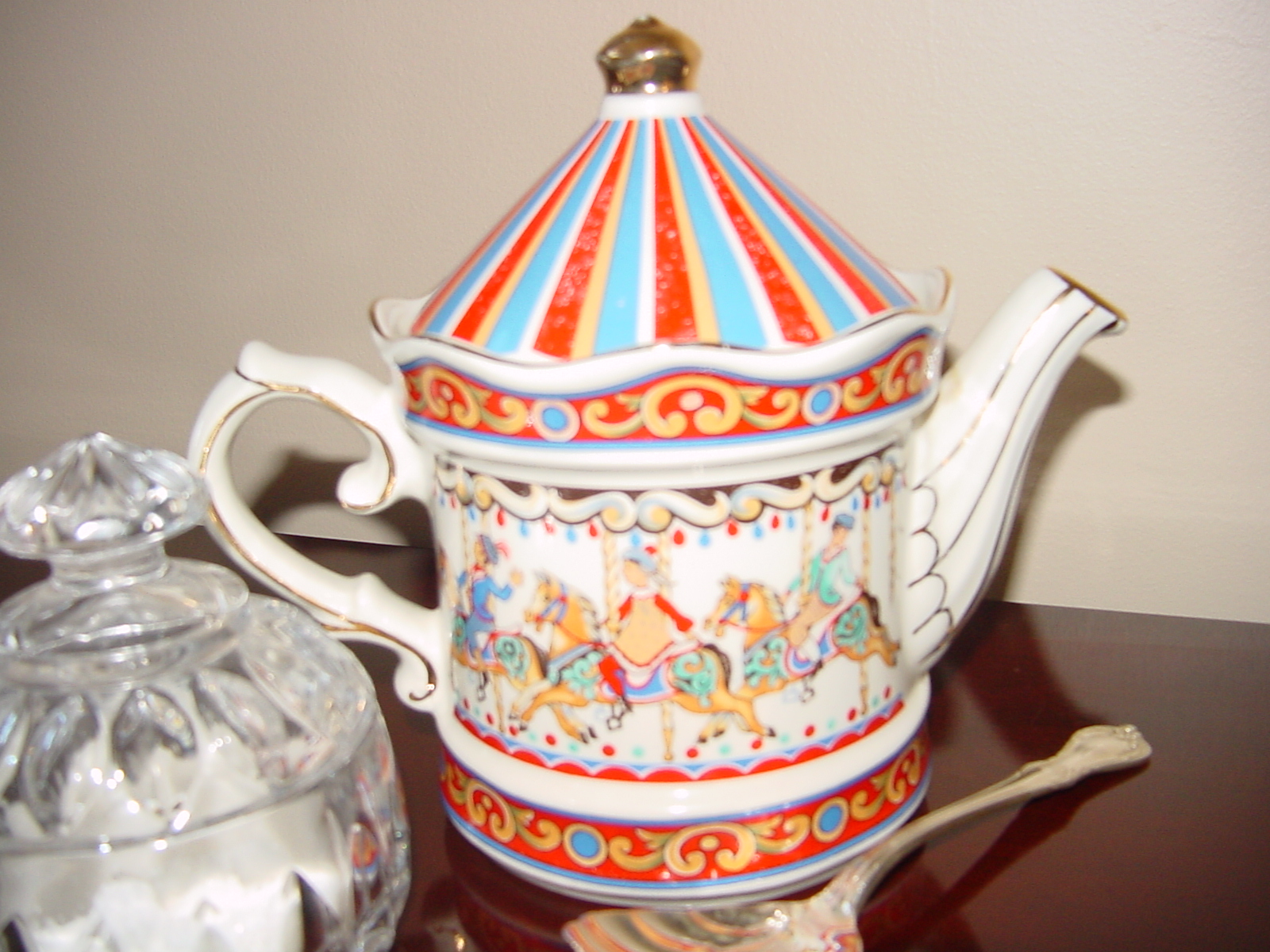 a decorative teapot that is on top of a table