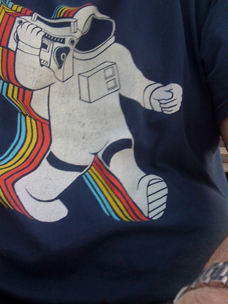 a close up view of a t - shirt showing an astronaut on the chest and side