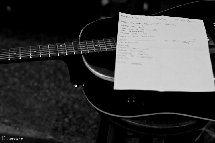 black and white image of an acoustic guitar with notes
