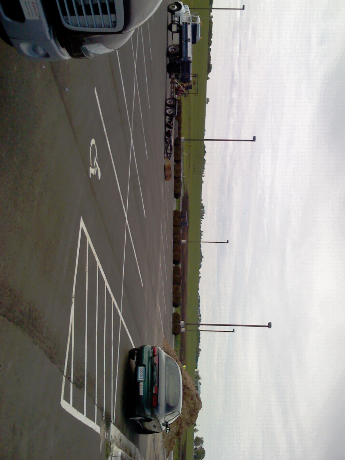 a parking lot with vehicles parked next to it