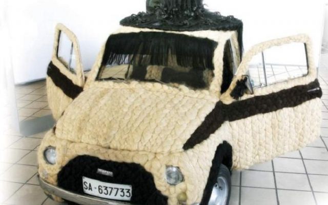 a car in knitted material sitting on the floor