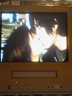 the television shows two people kissing each other