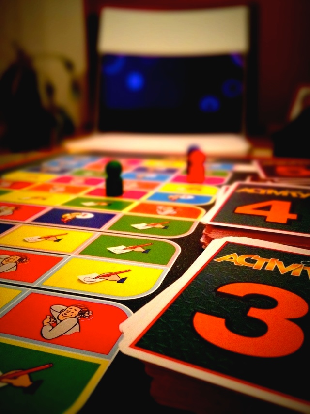 board games being played on table with various colored numbers