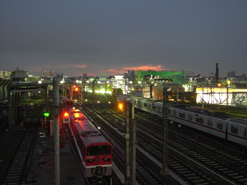 a group of trains traveling down train tracks