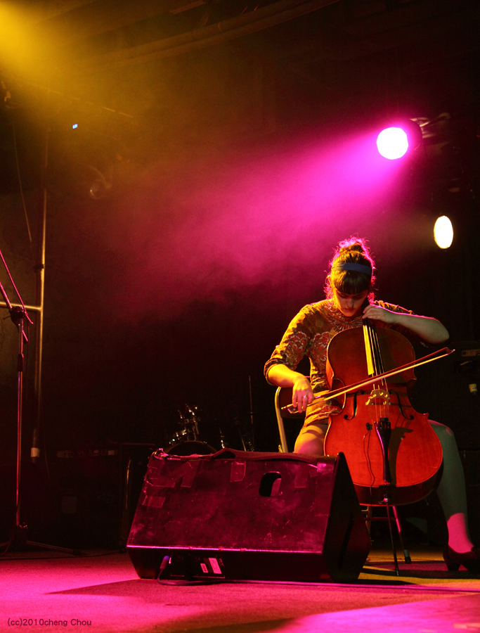 the man is playing on a double string instrument