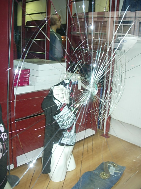 a broken glass is displayed at a window