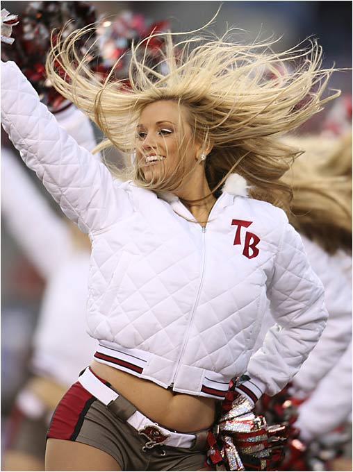 a cheerleader with her hair in the air