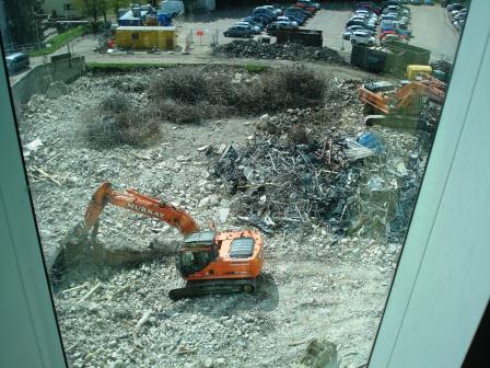 a work truck and a shovel are on the ground