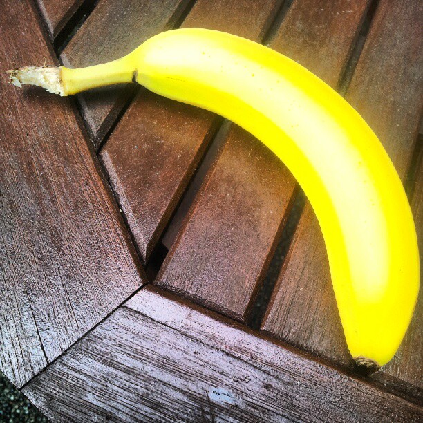 the long banana is on top of the wood