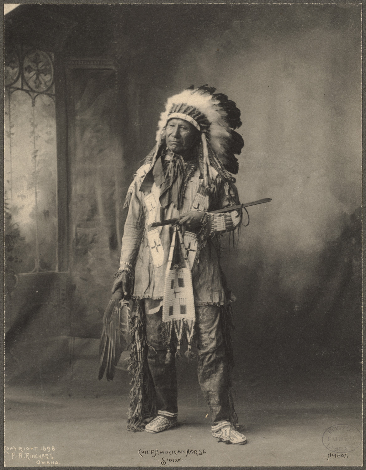 an old po of an indian standing in front of a mirror