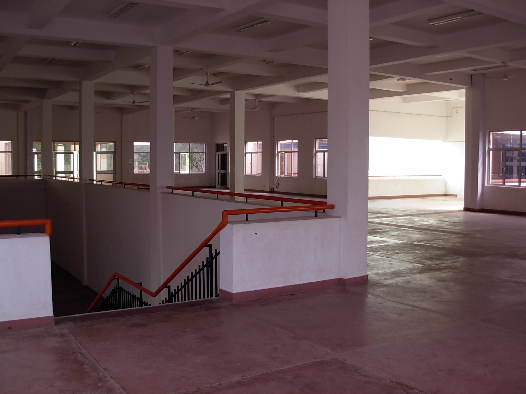 a long hallway with several railings on the floor