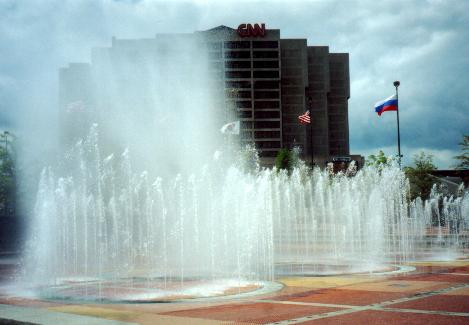 this is a water fountain in front of an apartment complex