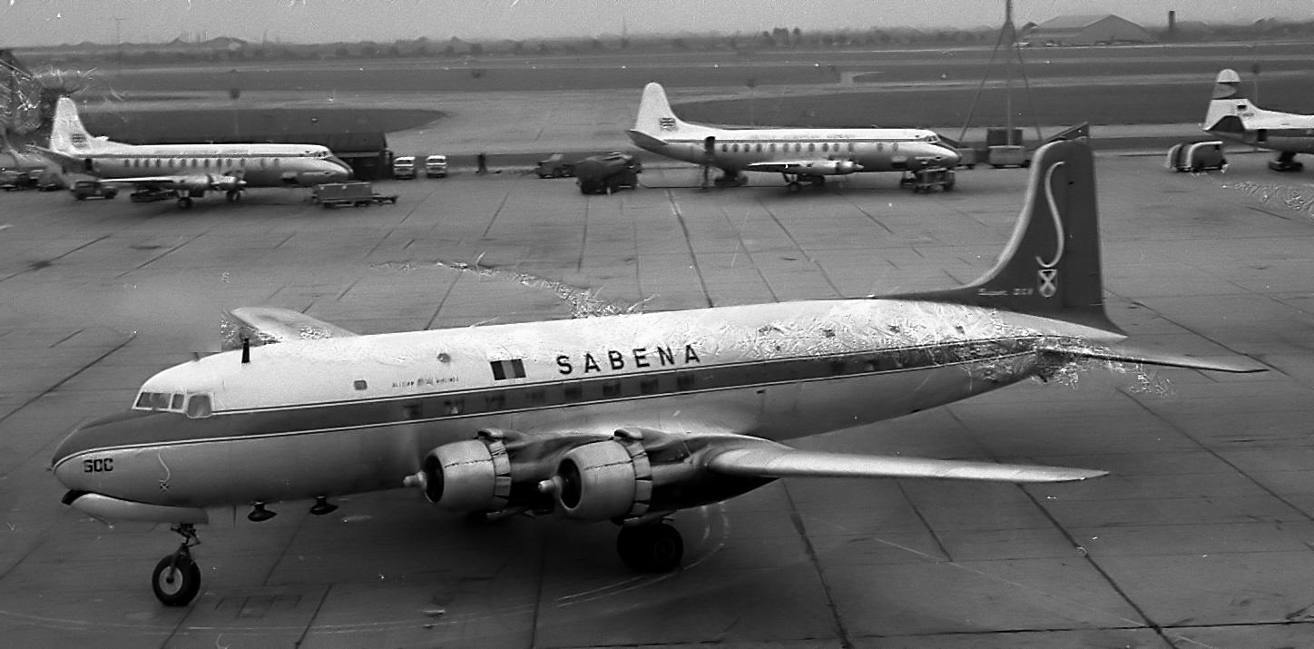 a silver air plane on the runway