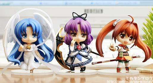 anime figures are shown on a table with one another