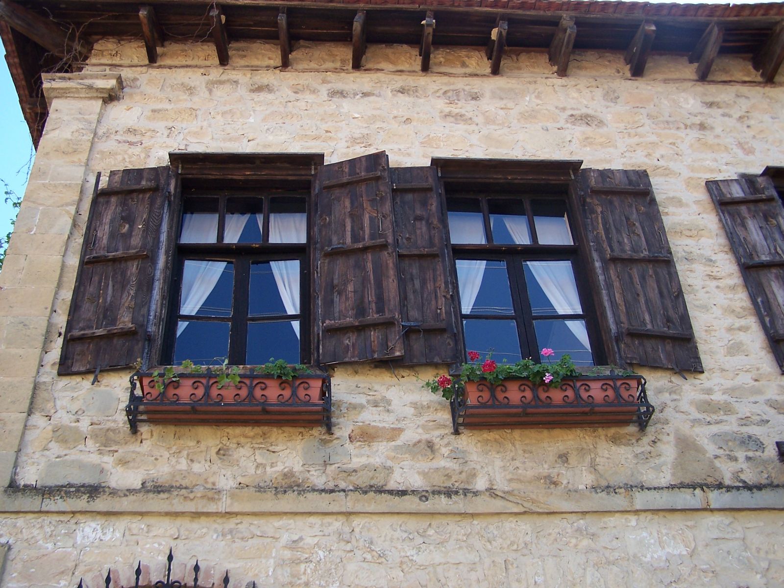 there are four windows on the side of this building