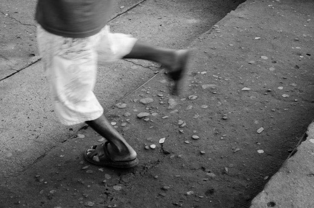 a person wearing all white on a sidewalk