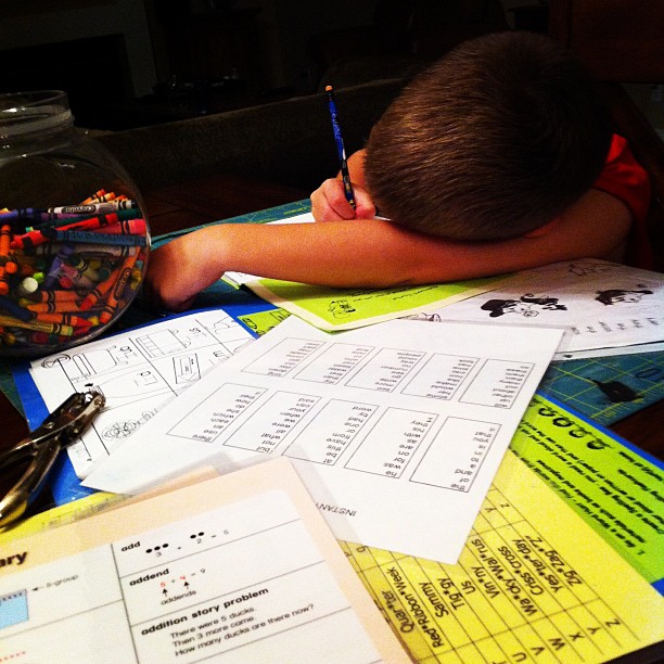 the boy is sleeping on his math homework