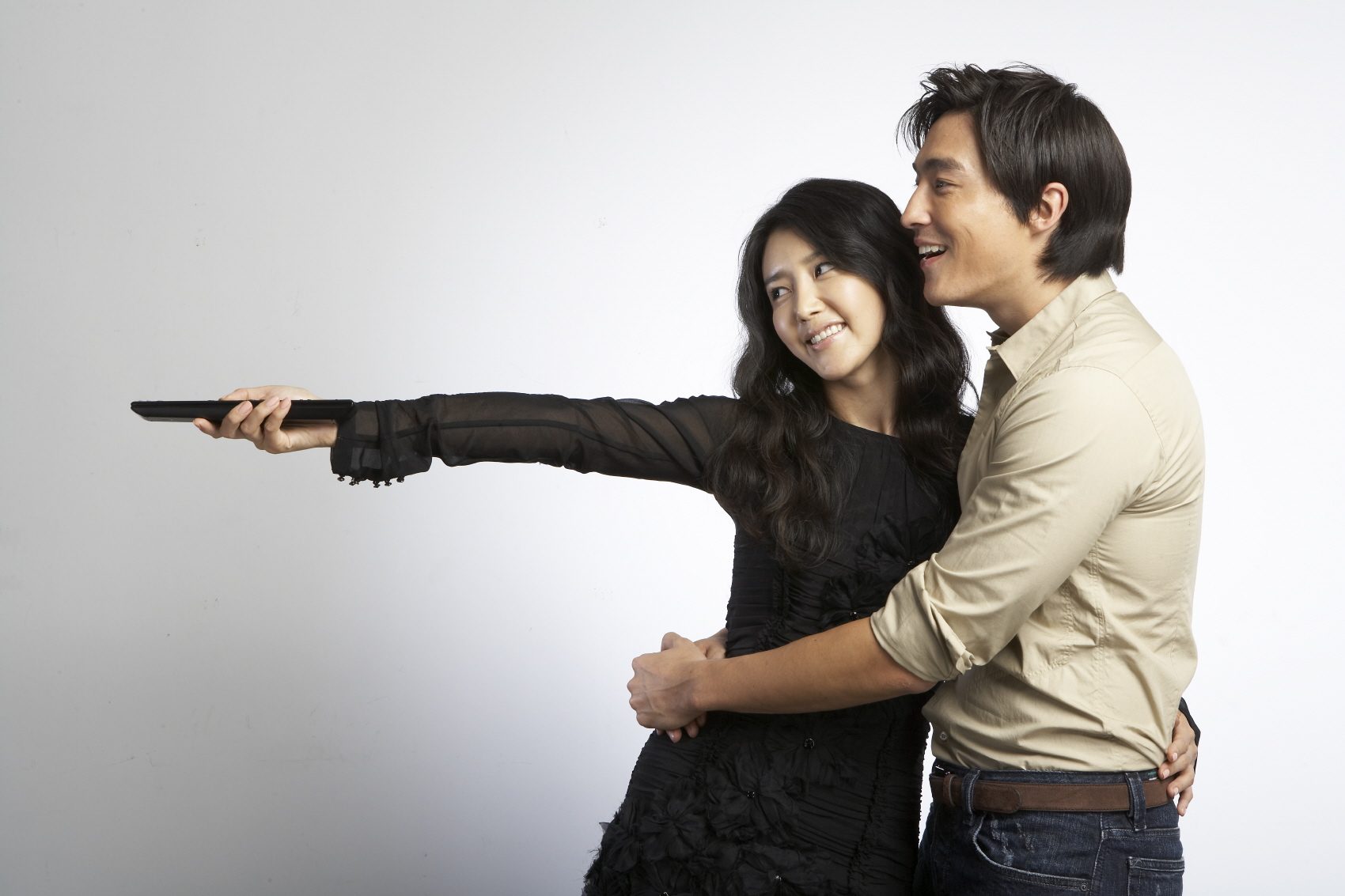 an asian woman and man taking a selfie