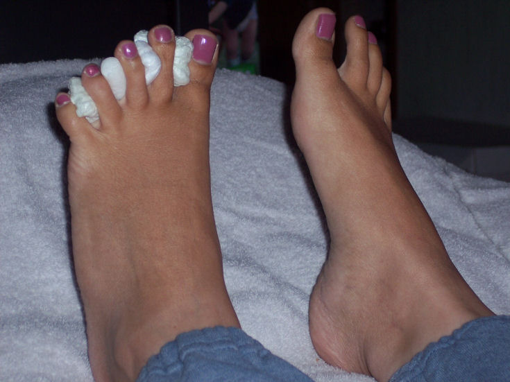 the feet have some pink and white designs on them