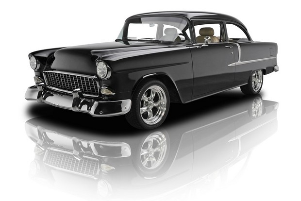 an old black car on a white background