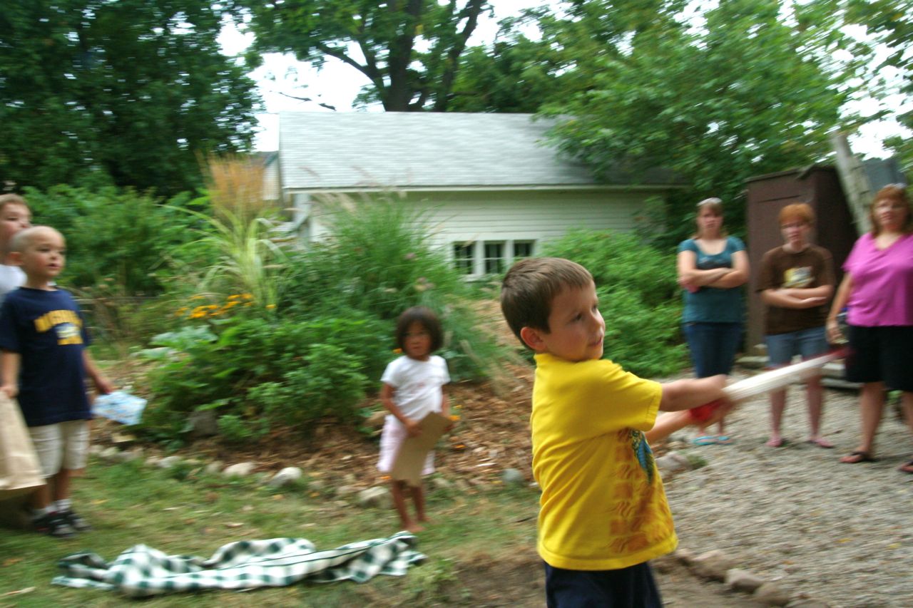 a boy holding a bat over his shoulder