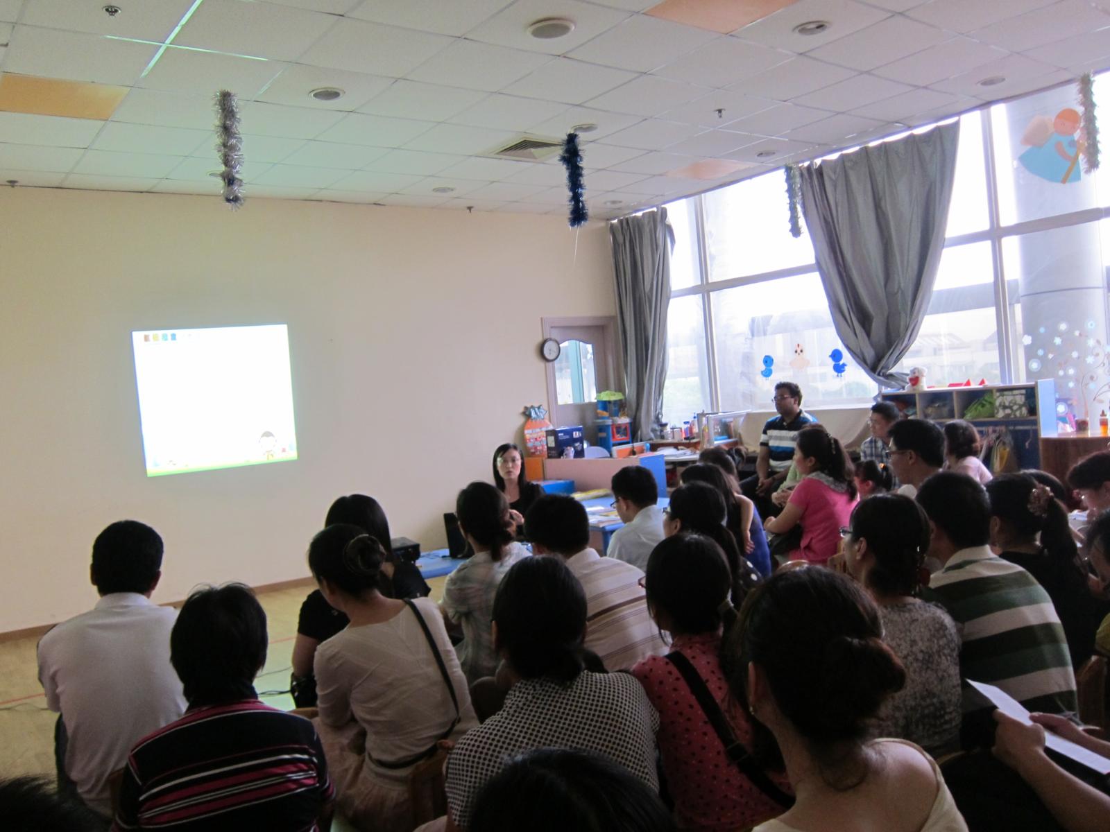 some people sit in front of a projector and watch soing on a screen