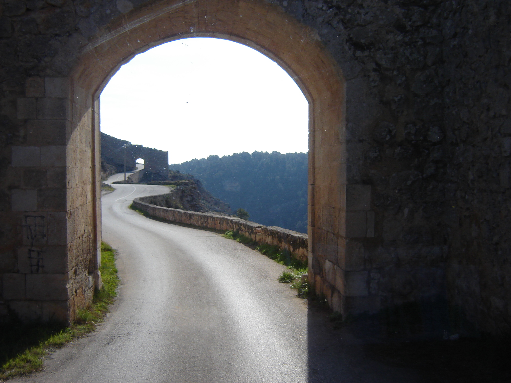 an archway near the road leading to the castle