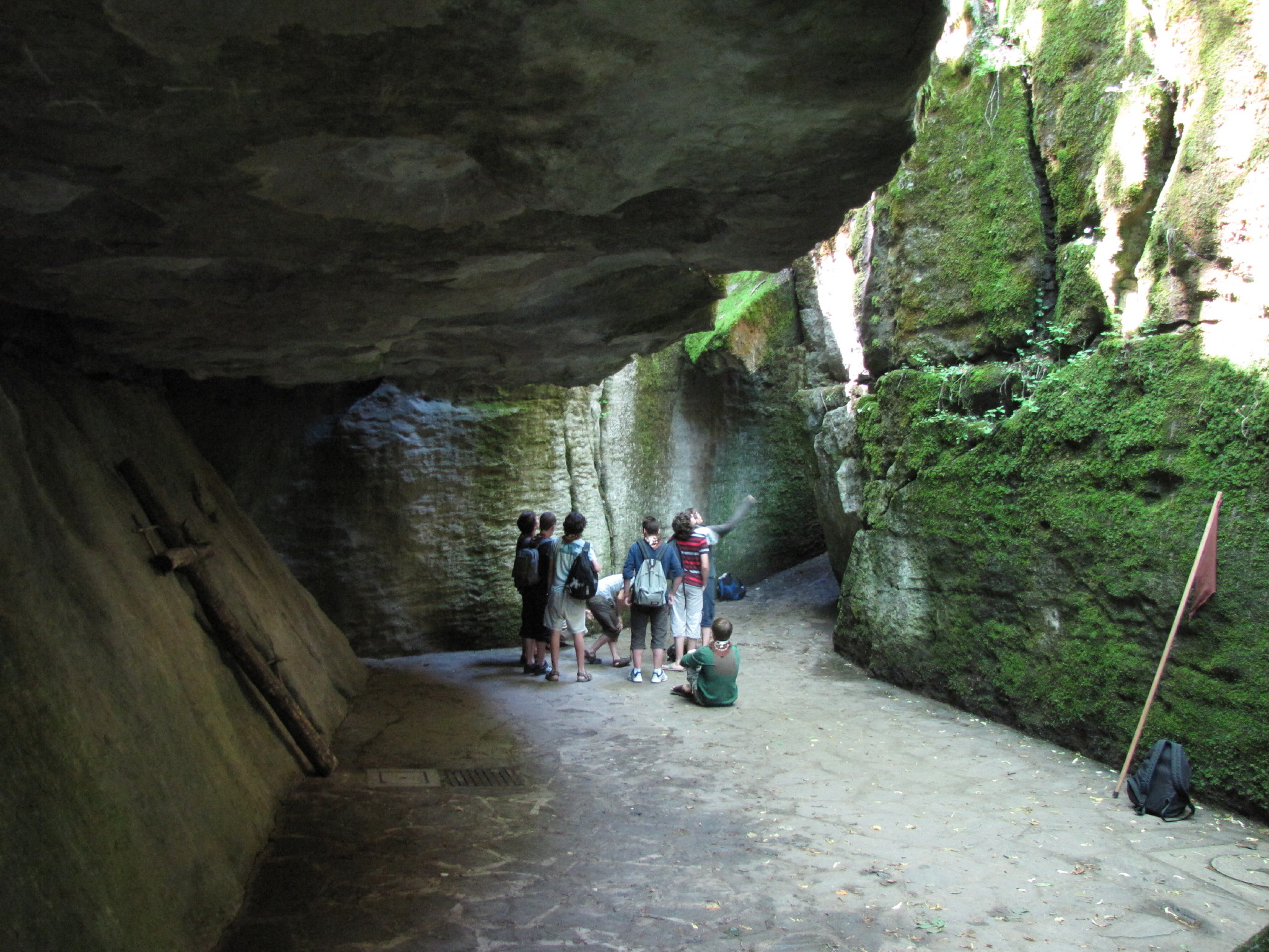 a group of people walking down a rocky trail