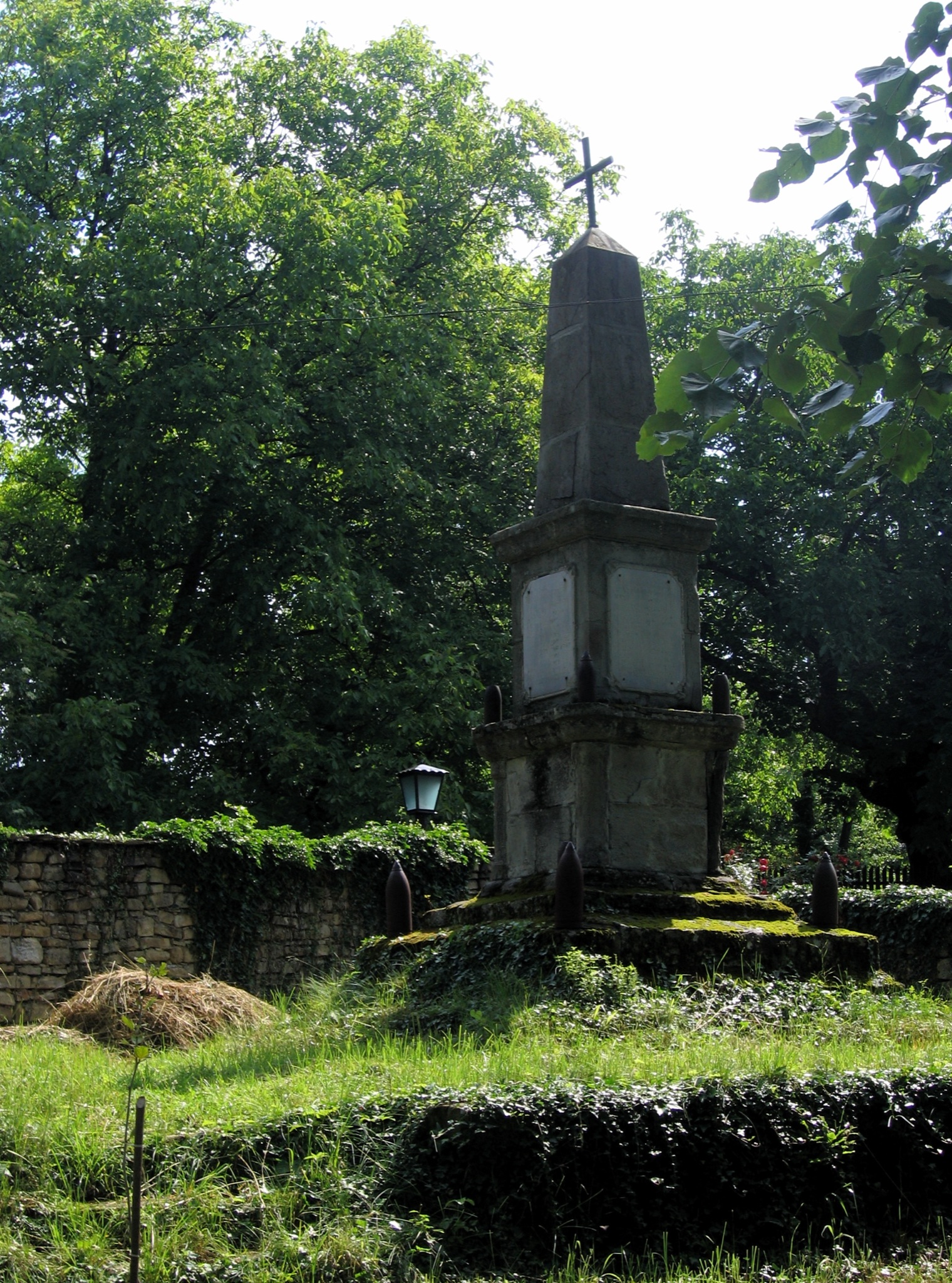 an old cemetery surrounded by trees and shrubbery