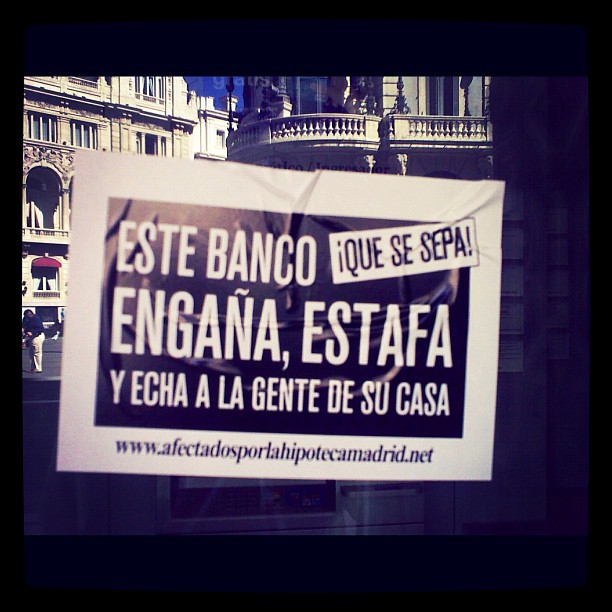 a sign in spanish on a city street