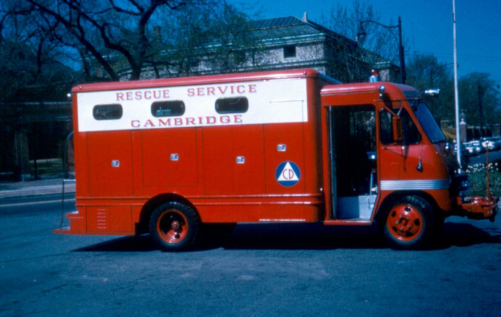 an old fire truck is sitting in the street