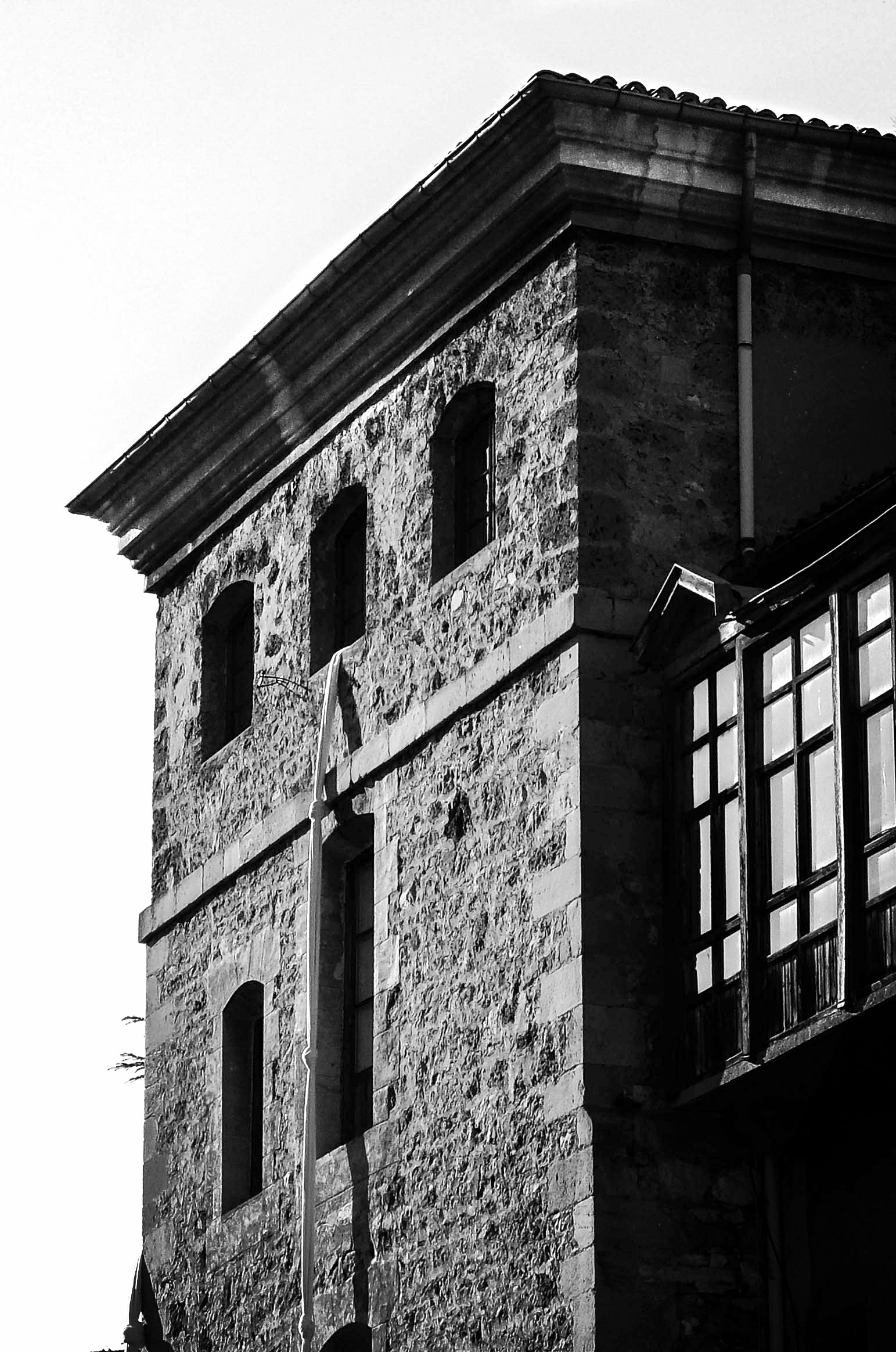 there is a very large old building with three windows