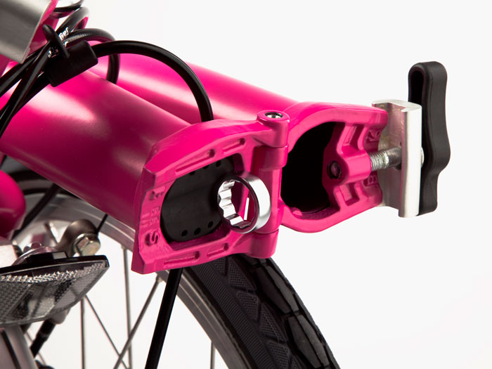 a bicycle with a pink handlebar cover