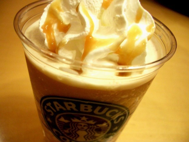 starbucks iced drink has whipped cream and caramel on top