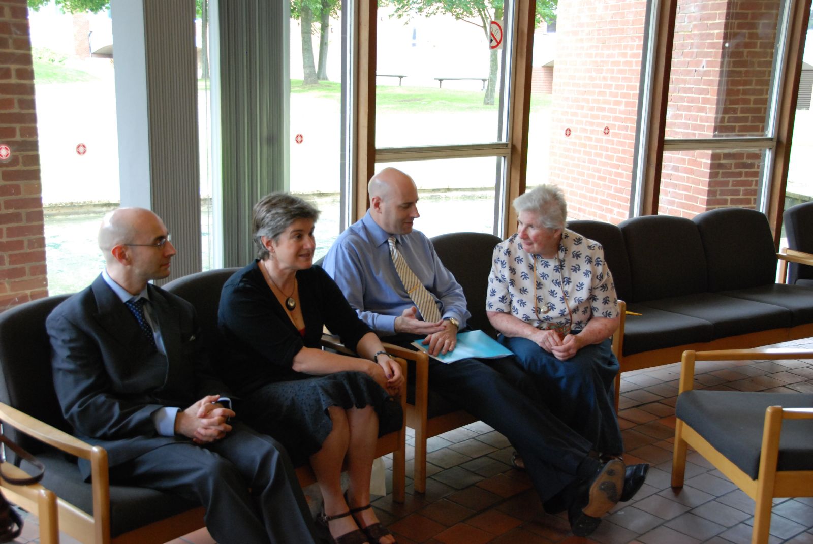 five people sitting down together to talk