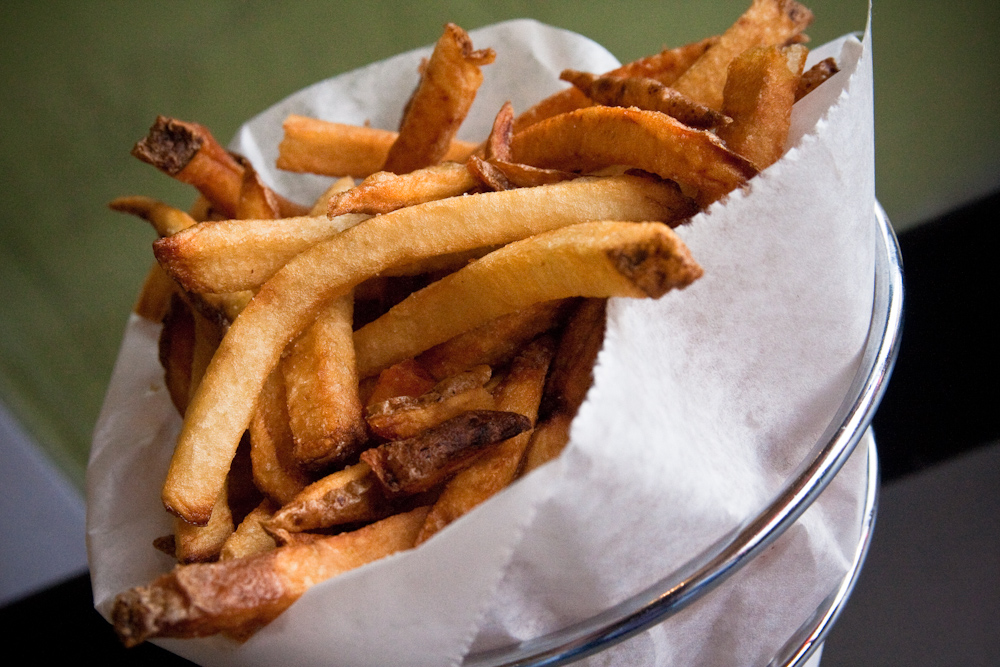 a bunch of french fries sitting on a plate