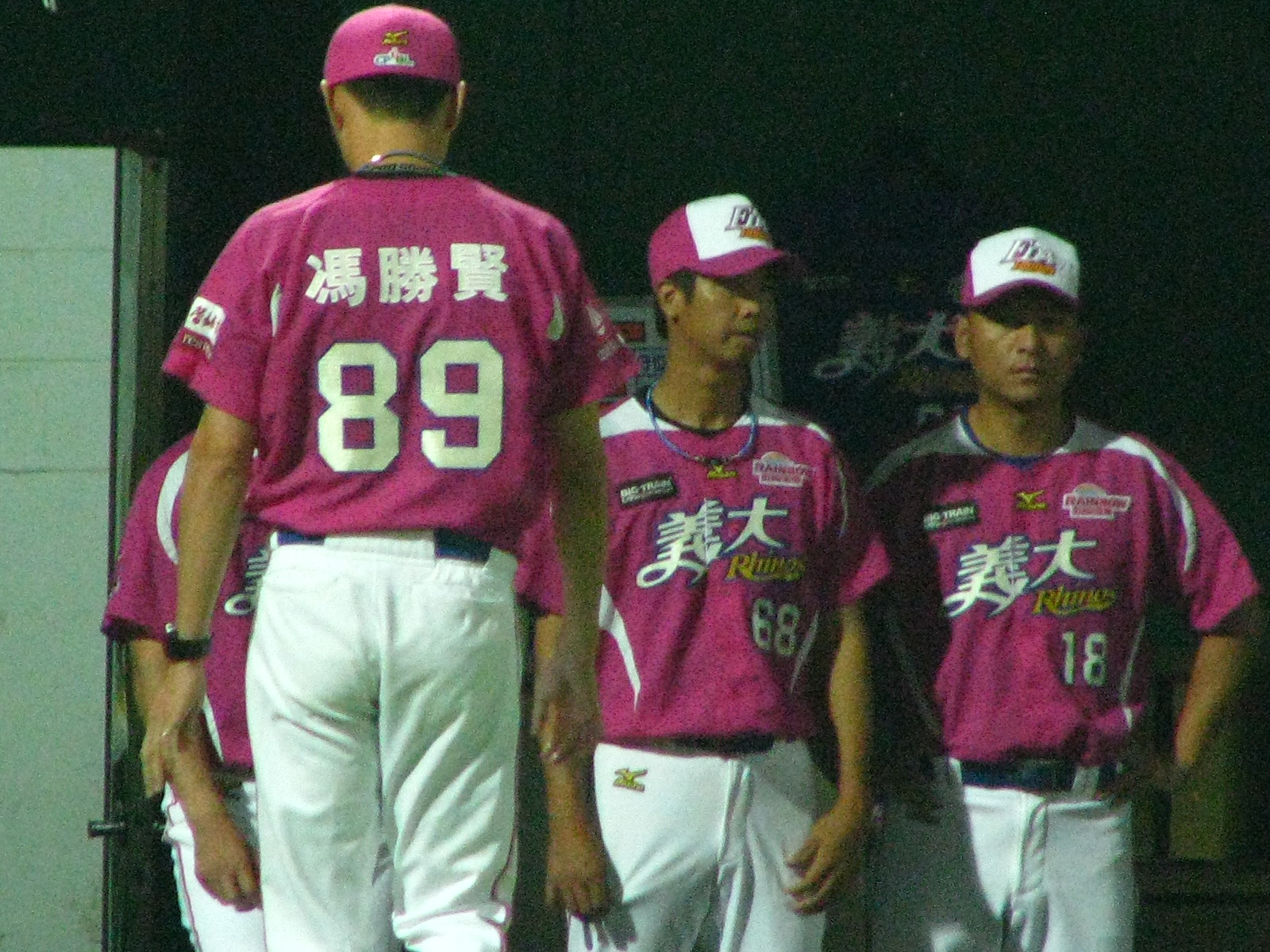 a group of baseball players in the dugout