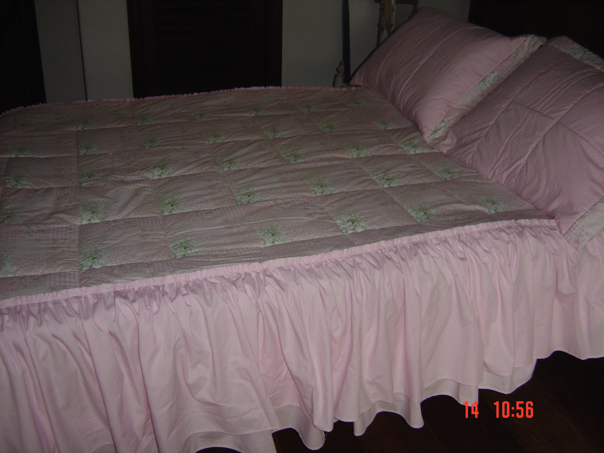 a close up of a neatly made bed in a room