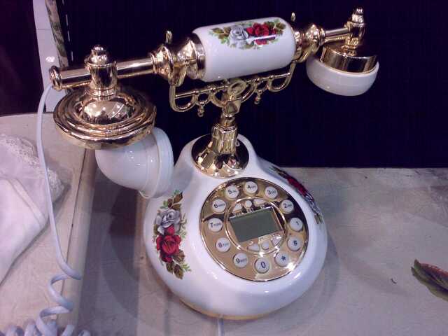 an old phone with a golden base has been decorated