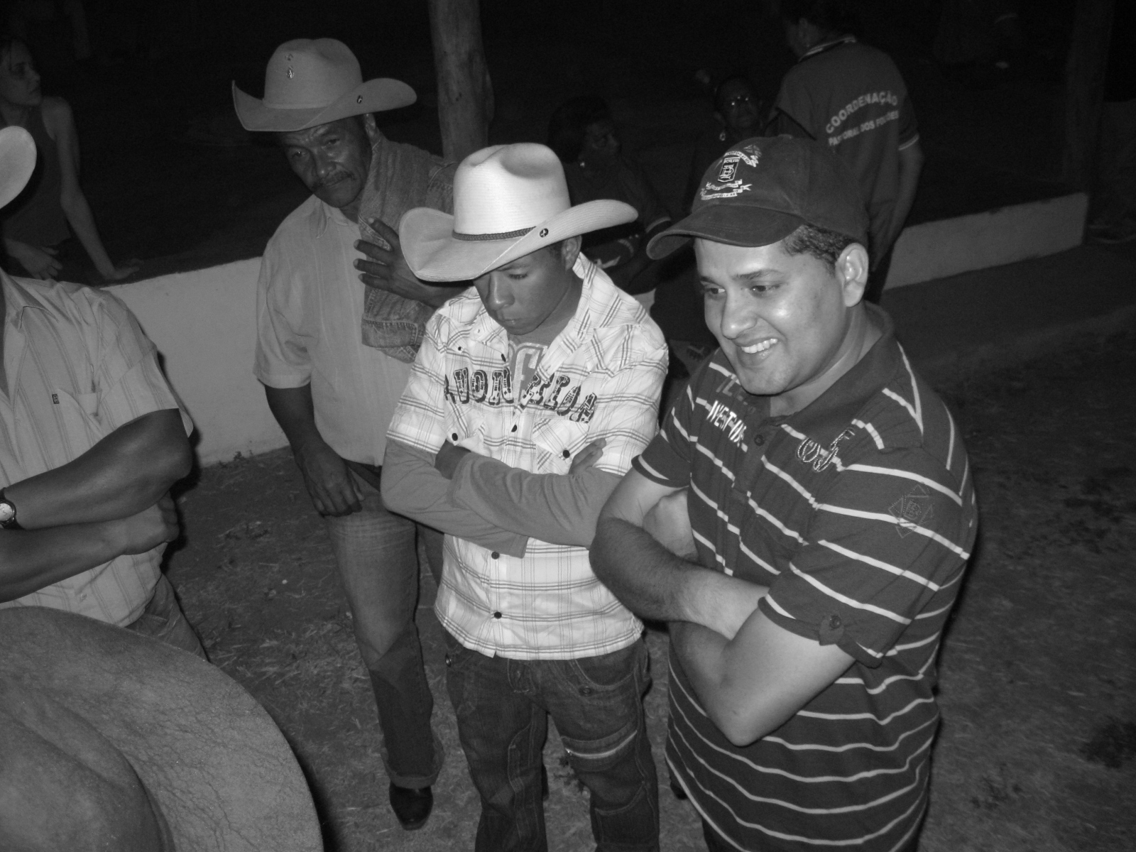black and white po of several men dressed in cowboy hats