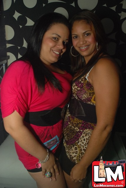 two women taking a picture together at a party