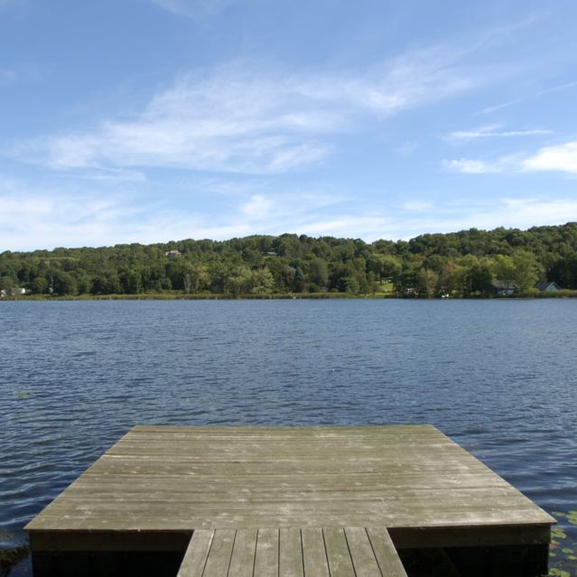 a pier on the shore of a lake
