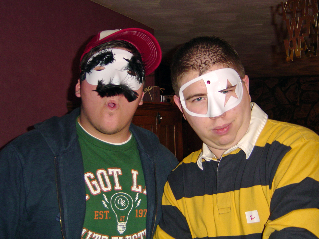 two people with eye masks posing for a po